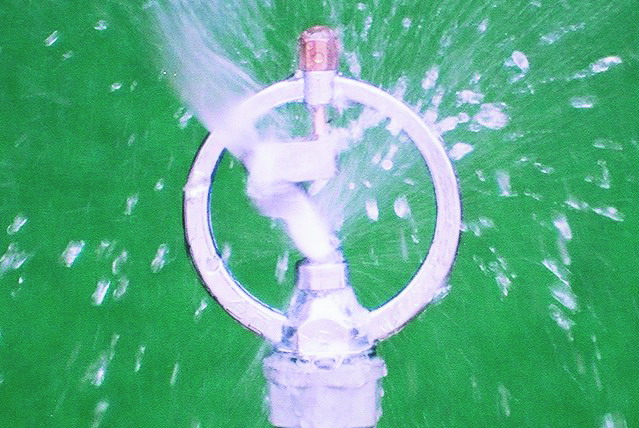 Close view of Butterfly Sprinkler operating (Spinning Sprinkler Head)